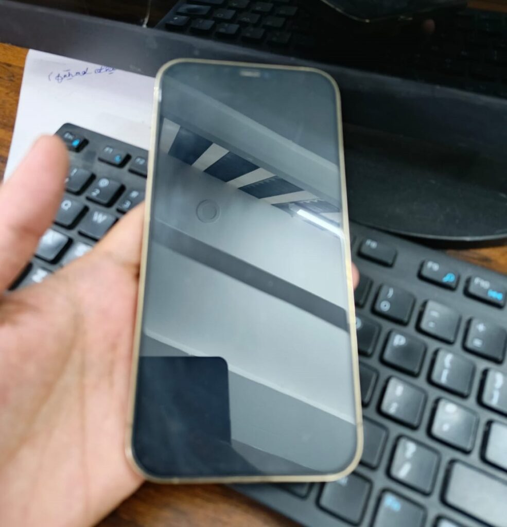 Close-up of iPhone 12 Pro Max screen and sleek flat design.