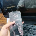 iPhone 12 Pro Max user interface showing lock screen layout