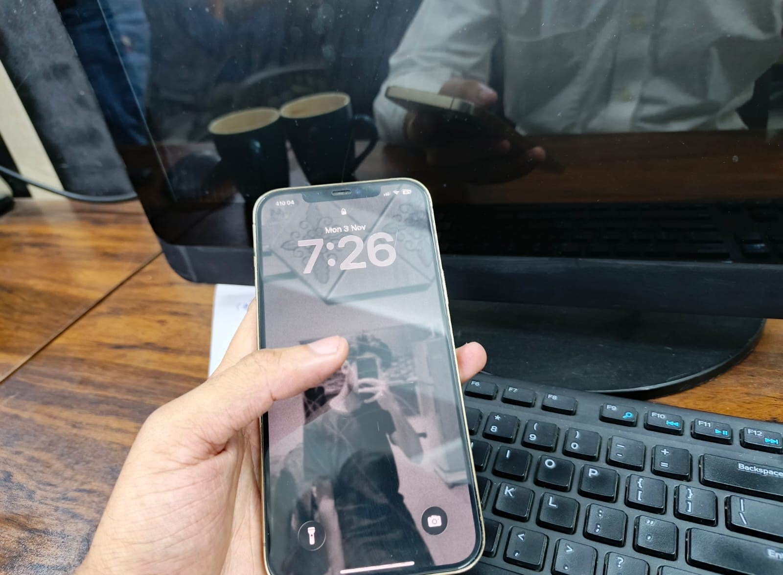 iPhone 12 Pro Max user interface showing lock screen layout